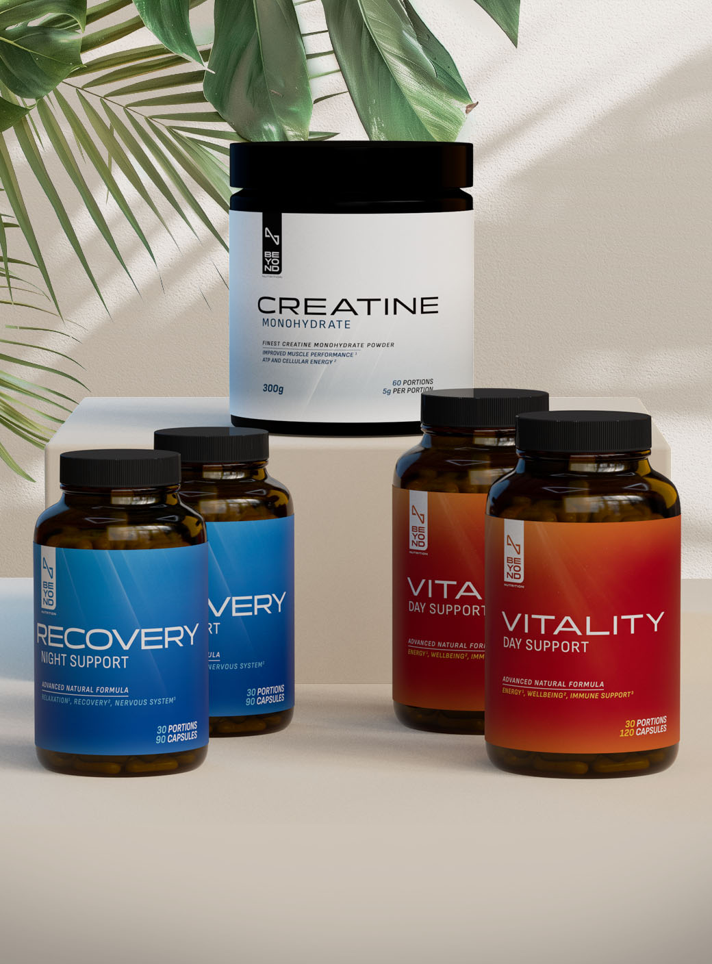 Supplement bottles labeled 'Recovery', 'Creatine', 'Vitality Day Support', and 'Vitality Night Support' on a light background.