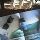 Recovery bottle on a holiday catalogue and a woden small ship