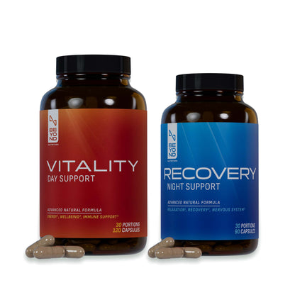Two supplement bottles, one labeled 'VITALITY DAY SUPPORT' in red and one 'RECOVERY NIGHT SUPPORT' in blue. Both contain capsules and are pictured with a white background.