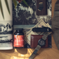 Tabletop with a bottle labeled 'Vitality', wallet, watch, and money on a scenic background