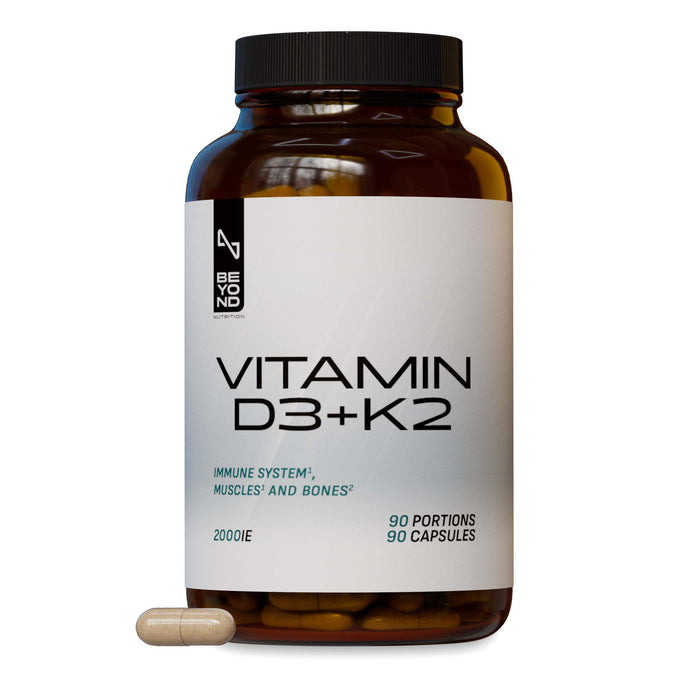 Amber Beyond Nutrition Vitamin D3 + K2 supplement bottle with white label, 2000 IU, 90 capsules, shown with one beige capsule on a white background