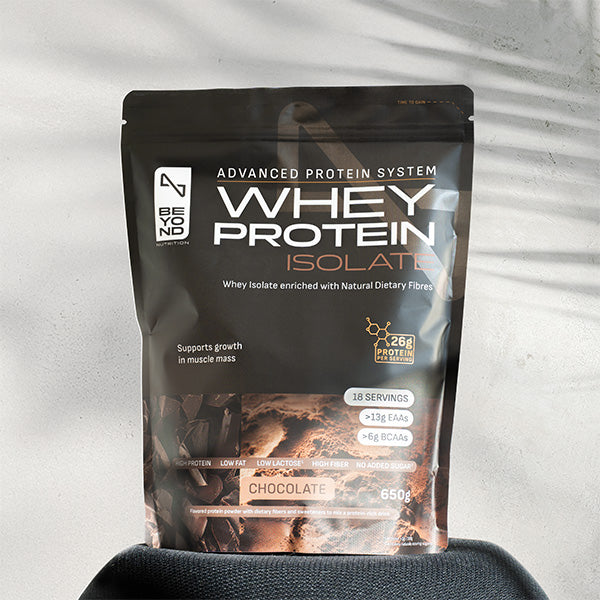 Whey protein isolate package on a light gray background