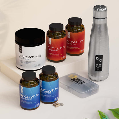 Supplement bottles and a water bottle on a light background