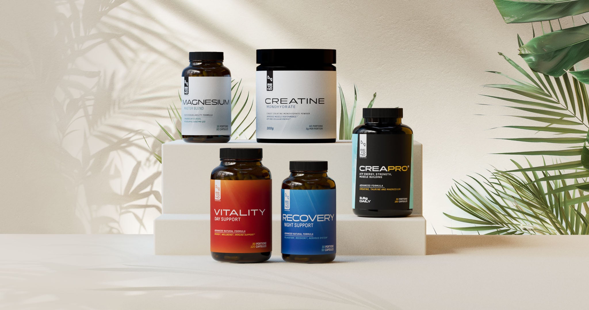 Collection of supplement bottles on a white surface with a natural leafy background