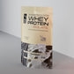 Whey protein isolate package on a gray background